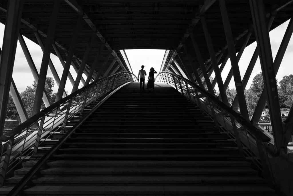 Couple walking down the bridge