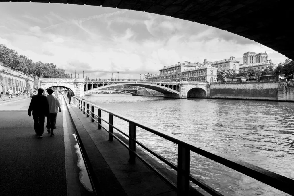 Couple walking near Notre-Dame in Paris