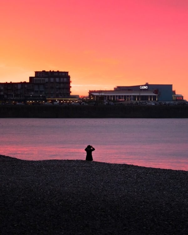 Photographer at Mers-les-Bains beach at sunset