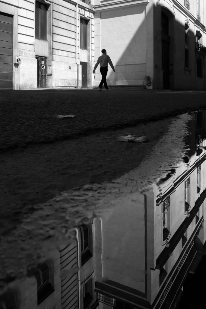 Man crossing the stree near Orsay Museum, Paris